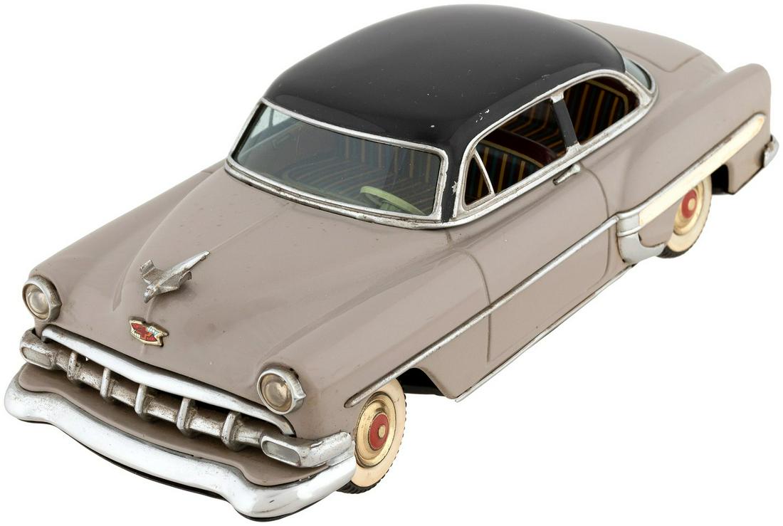 CHEVROLET 1954 TWO DOOR SEDAN MARUSAN FRICTION TIN CAR.: 11" long. Large and impressive painted tin/tin litho with rubber tires and tin litho hubcaps. Made by Marusan/Kosuge (as marked on underside) in Japan for distribution by Line Mar (as marked on back w