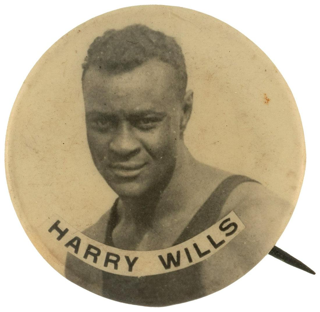 C. 1926 HARRY WILLS REAL PHOTO BUTTON.: C. 1926 HARRY WILLS REAL PHOTO BUTTON. 1", no maker, real photo button w/tiny 1/8" cello split along the collet. Jack Johnson's championship did not lead to opportunity for future black boxers but rat