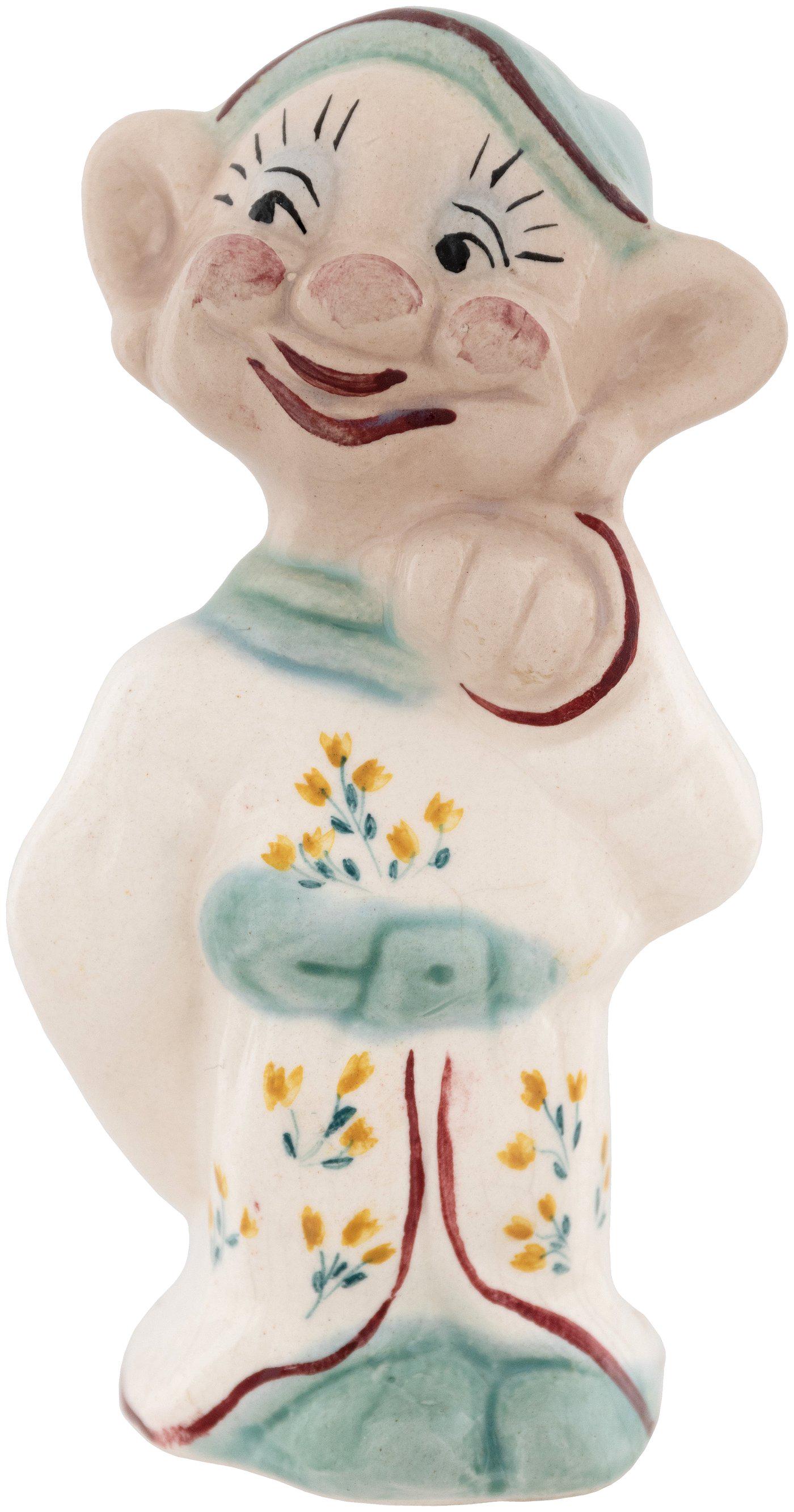 DOPEY WADE RARE AND FIRST WE'VE OFFERED F.W. WOOLWORTH: DOPEY WADE RARE AND FIRST WE'VE OFFERED F.W. WOOLWORTH COMPANY CERAMIC FIGURINE. 3.5" painted and glazed figurine. Nicely detailed with flowers on his outfit. In 1937 F.W. Woolworth commissioned Wade