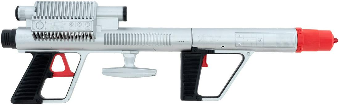 RARE LOST IN SPACE ROTO JET GUN IN SHIPPING BOX.: RARE LOST IN SPACE ROTO JET GUN IN SHIPPING BOX. 7.25x13.5x4" deep plain cardboard mailer box. Mattel ©1966 Space Productions. This is the Montgomery Ward mail-away catalogue item, not the store