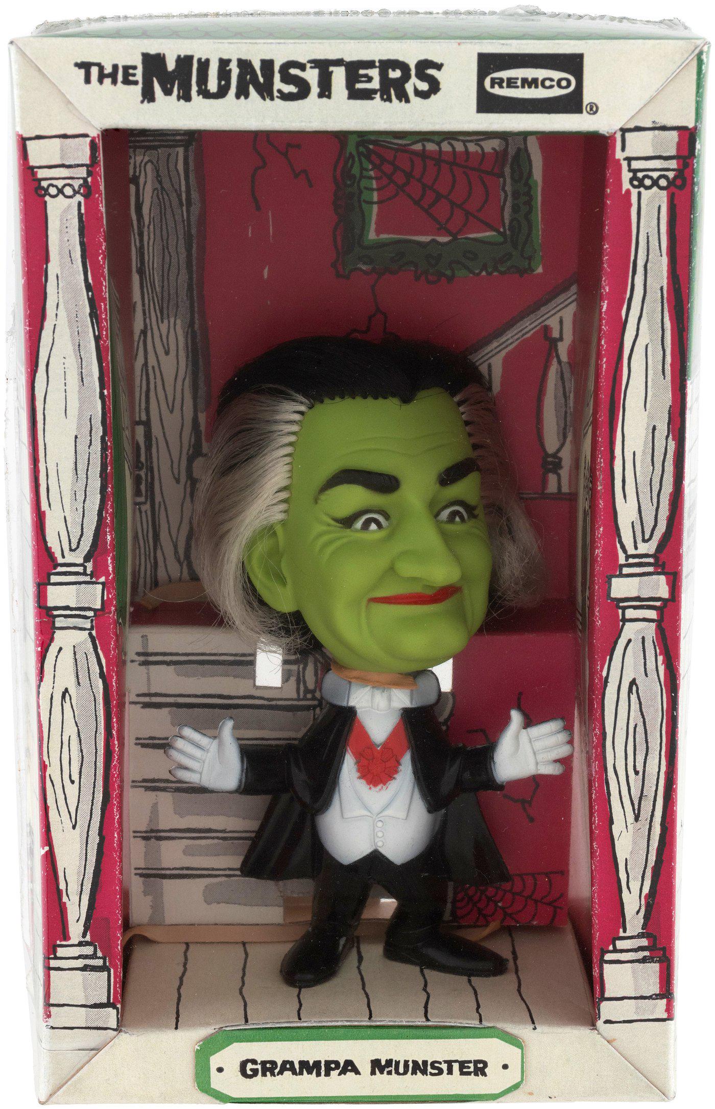 REMCO GRANDPA MUNSTER FACTORY-SEALED BOXED DOLL.: From same set of three as previous two lots. Box shrink-wrapped as issued w/split along left seam of shrink-wrap, but still factory-sealed. VF/Exc. overall. Figure has hard plastic body, soft vinyl he