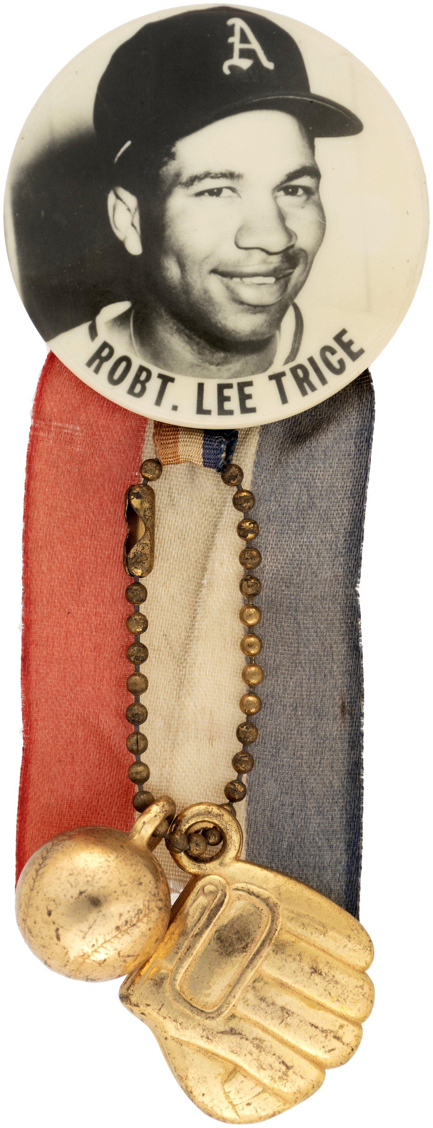 1954 ROBERT LEE TRICE PM10 REAL PHOTO STADIUM BUTTON.: 1.75". No maker but w/union back stamp. Spring pin holds ribbon, metal chain w/baseball and glove. Bob Trice began his professional baseball career in the Negro Leagues playing for the Homestead Grays