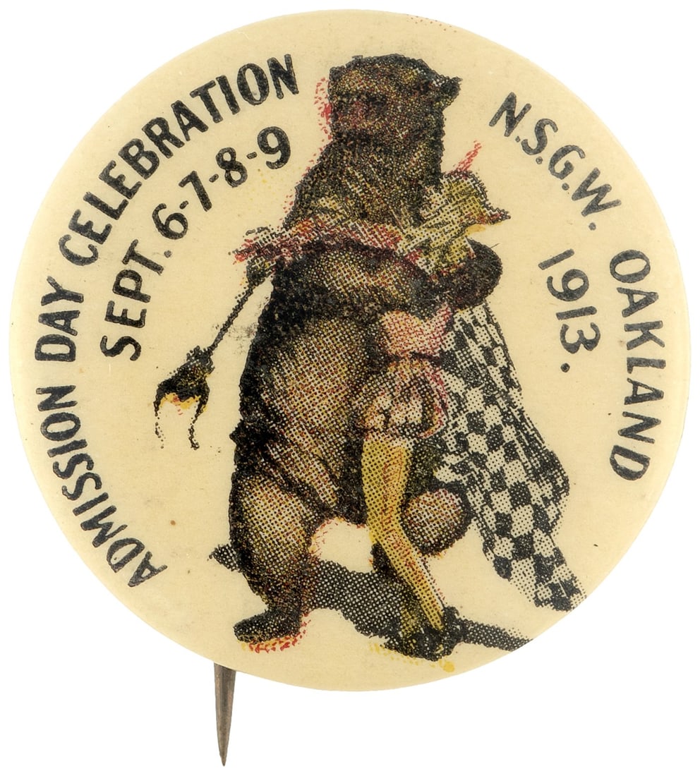 OAKLAND 1913 CELEBRATION BUTTON WITH GRIZZLY BEAR GIVING JESTER A BEAR HUG.: 1.25" with Irvine & Jachens of S.F. back paper. The California-born Native Sons of the Golden West (N.S.G.W.) issued this button for their "Oakland Sept. 6-7-8-9/1913/Admission Day Celebration". A gia