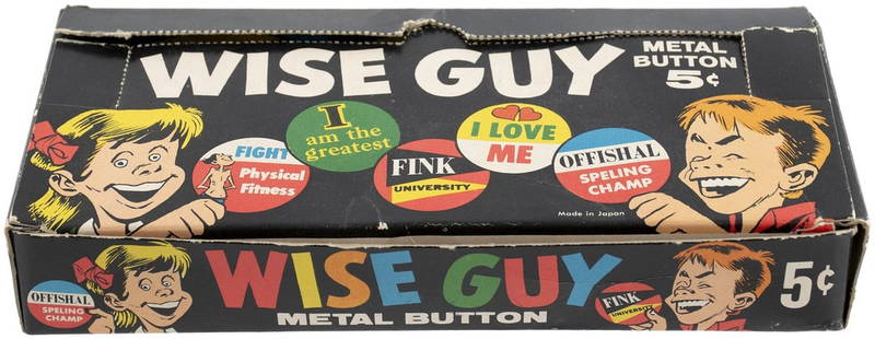 1965 TOPPS WISE GUY METAL BUTTON FULL DISPLAY BOX (JACK DAVIS ART).: 3.75x8x1.25" deep box contains complete amount of twenty-four 2.5x3.5" unopened paper packs each containing a 2" dia. tin litho button. ©1965. There are 24 different buttons in the series. The co