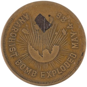 HAYMARKET CHICAGO 1886 LABOR MASSACRE TOKEN WITH PIECE OF THE BOMB EMBEDDED AS A RELIC.