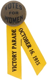 VOTES FOR WOMEN SUFFRAGE BUTTON WITH "VICTORY PARADE" CELLO RIBBON.