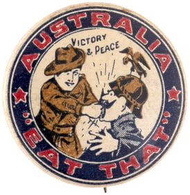 WWI C. 1915 BUTTON SHOWS AUSSIE SOLDIER PUNCHING KAISER WILHELM IN THE MOUTH WITH RIM TEXT "EAT