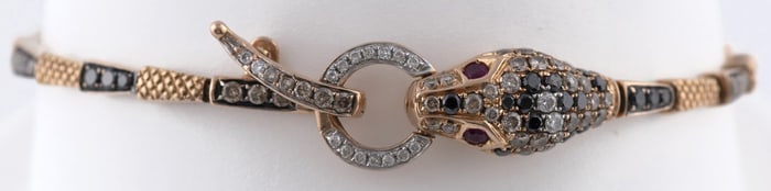 18K ROSE GOLD ARTICULATED SERPENT BRACELET.