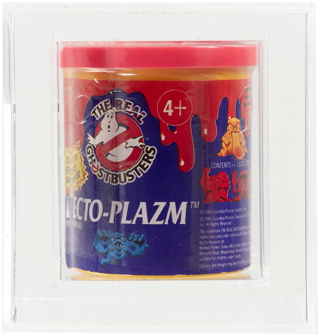 THE REAL GHOSTBUSTERS (1986) - ECTO-PLAZM SERIES 1 (RED) UKG 80%.: UKG graded and encapsulated container of Kenner Ecto-Plazm play gel w/one of three different Ecto-Ghost figurines. Red Ecto-Plazm color. Mark Warner (UK) Collection.