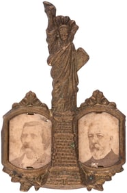 BLAINE & LOGAN 1884 STATUE OF LIBERTY JUGATE SHELL BADGE.