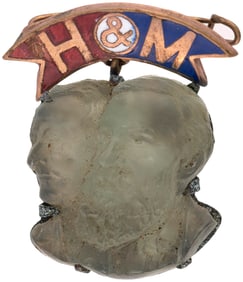 H&M ENAMEL HANGER WITH FIGURAL HARRISON & MORTON MOONSTONE BUSTS.