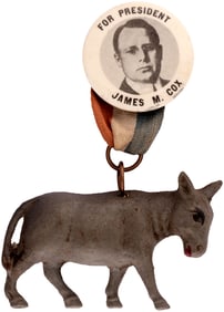 FOR PRESIDENT JAMES M. COX BUTTON WITH RIBBON HOLDING CELLULOID DONKEY.