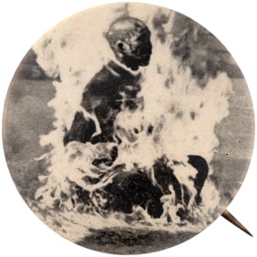 EARLY AND HORRIFIC ANTI-VIETNAM WAR BUTTON SHOWING SELF IMMOLATED BUDDIST MONK.