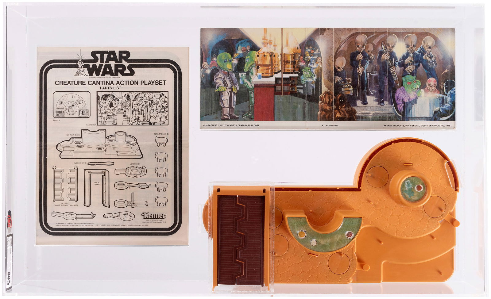 STAR WARS (1979) - CREATURE CANTINA ACTION PLAYSET UKG 80%.: UKG graded and encapsulated Kenner playset base w/action levers, opening front door and circular bar, encapsulated w/cardboard backdrop and instruction folder. Some scattered scratches to bottom of UK