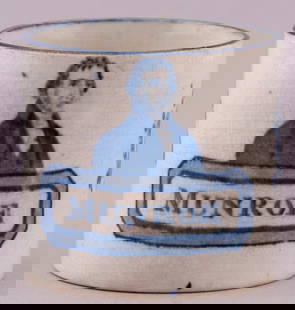 JAMES MONROE IMPORTANT & RARE PORTRAIT CHILDS CUP.: 2.5&#8221; tall by 3.5&#8221; dia. including handle. Striking blue "Munroe" (sic) portrait transfer w/Federal eagle and stars. Arman M.21. Expected crazing w/no damage or repairs. Extremely Fine. Amon