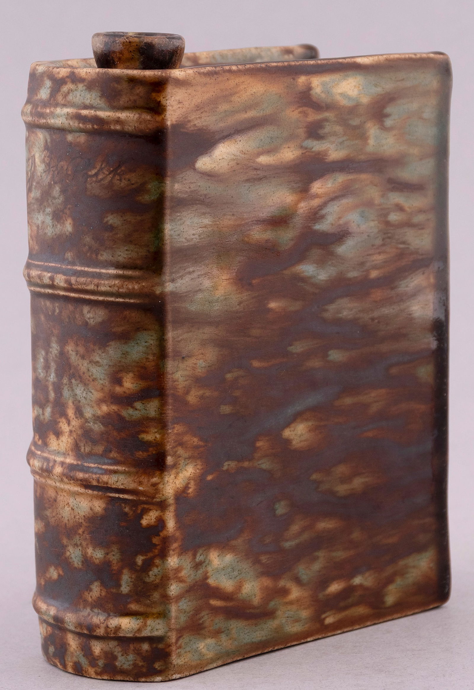 JAMES K. POLK CERAMIC BOOK FLASK BENNINGTON POTTERY FLINT GLAZE.: 5.5” tall, 4” wide, 2” deep. Lovely green marble w/inscribed "James K. Polk" on spine.Scattered spots of roughness at scalloped page edge in spots from original firing. No condition