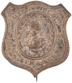 McCLELLAN LIBERTY 1864 SILVERED BRASS SHELL BADGE.