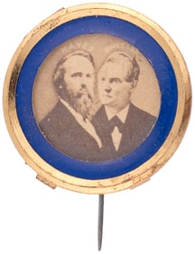 “HAYES WHEELER” 1876 COLOR ACCENTED BRASS RIM JUGATE BADGE HAKE #3027.