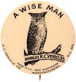 RARE C. 1905-09 OWL STATING “A WISE MAN HANDLES K.C. VEHICLES” BUTTON.