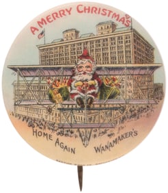 EARLY 1900s SANTA IN BI-PLANE BUTTON FROM WANAMAKERS SHOWING "STYLE B" BUILDING.