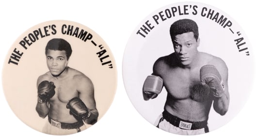 MUHAMMAD ALI “THE PEOPLE’S CHAMP” VINTAGE & MOVIE PROP BUTTON PAIR.