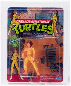 TEENAGE MUTANT NINJA TURTLES (1988) - APRIL O'NEIL SERIES 1/10 BACK CAS 85 (ORANGE STRIPES/PRESS).