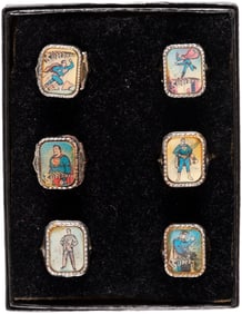 SUPERMAN ACTION RING 1960s SET OF 6 WITH VENDING PAPER.