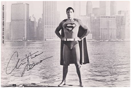 CHRISTOPHER REEVE SIGNED SUPERMAN PHOTO CARD.: Glossy 4x6" card features bw photo of Christopher Reever (1952-2004) in costume as Superman. Reeve has signed at lower left in black ink. Card has printed "Plaza (Design & Print) USA /212-427-7047