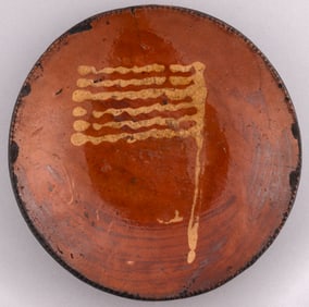 YELLOW SLIP FLAG MOTIF REDWARE 9" PLATE.