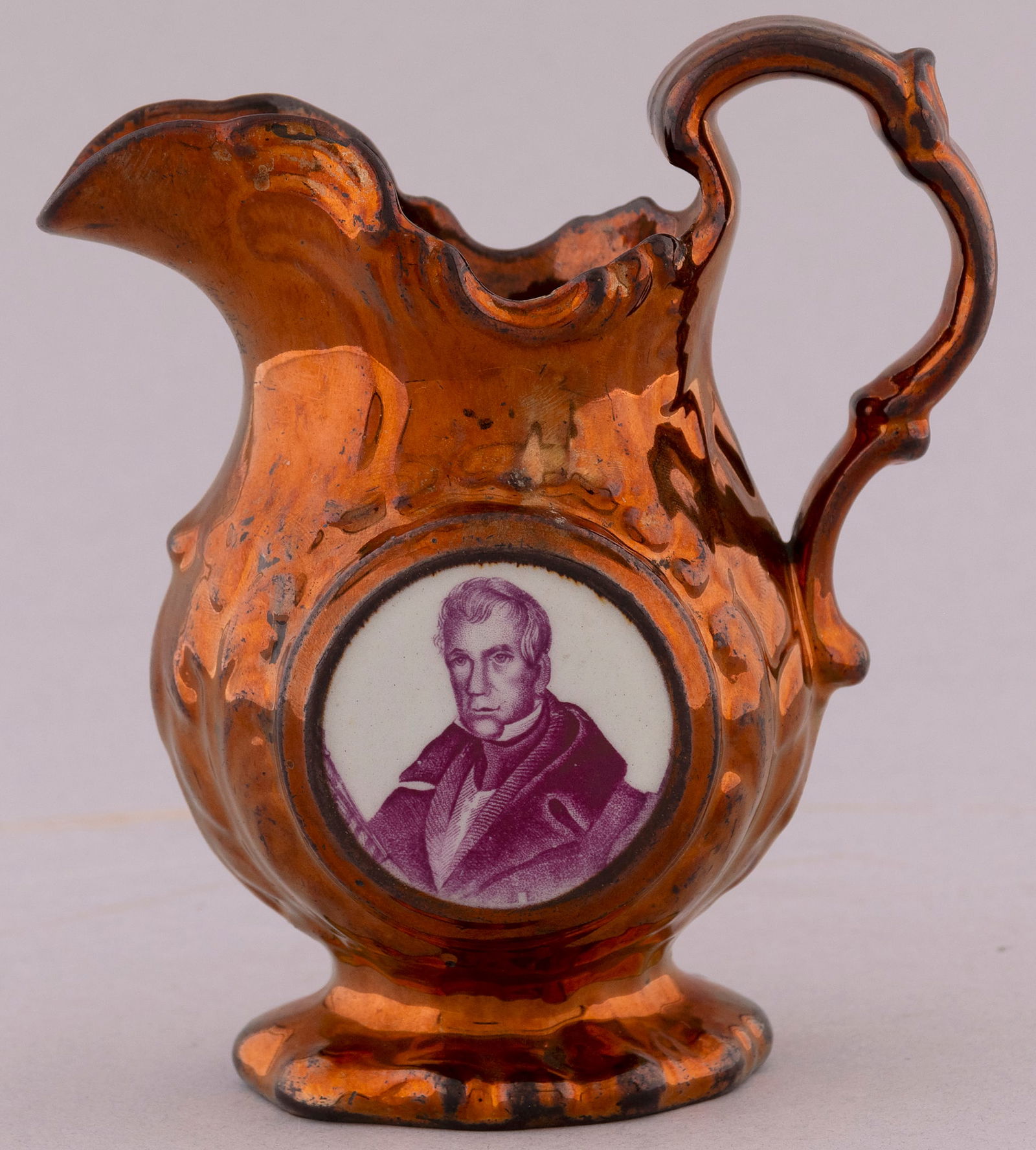 W.H. HARRISON 1840 CAMPAIGN SAKE OF UNION COPPER LUSTER PITCHER.: 5.25" tall. Portrait front mulberry inset w/fasces, circle of stars & eagle holding a Sake of (Union is truncated) banner reverse. Beautiful hand-written inventory label. Exc. Rex & Patti Stark Collec