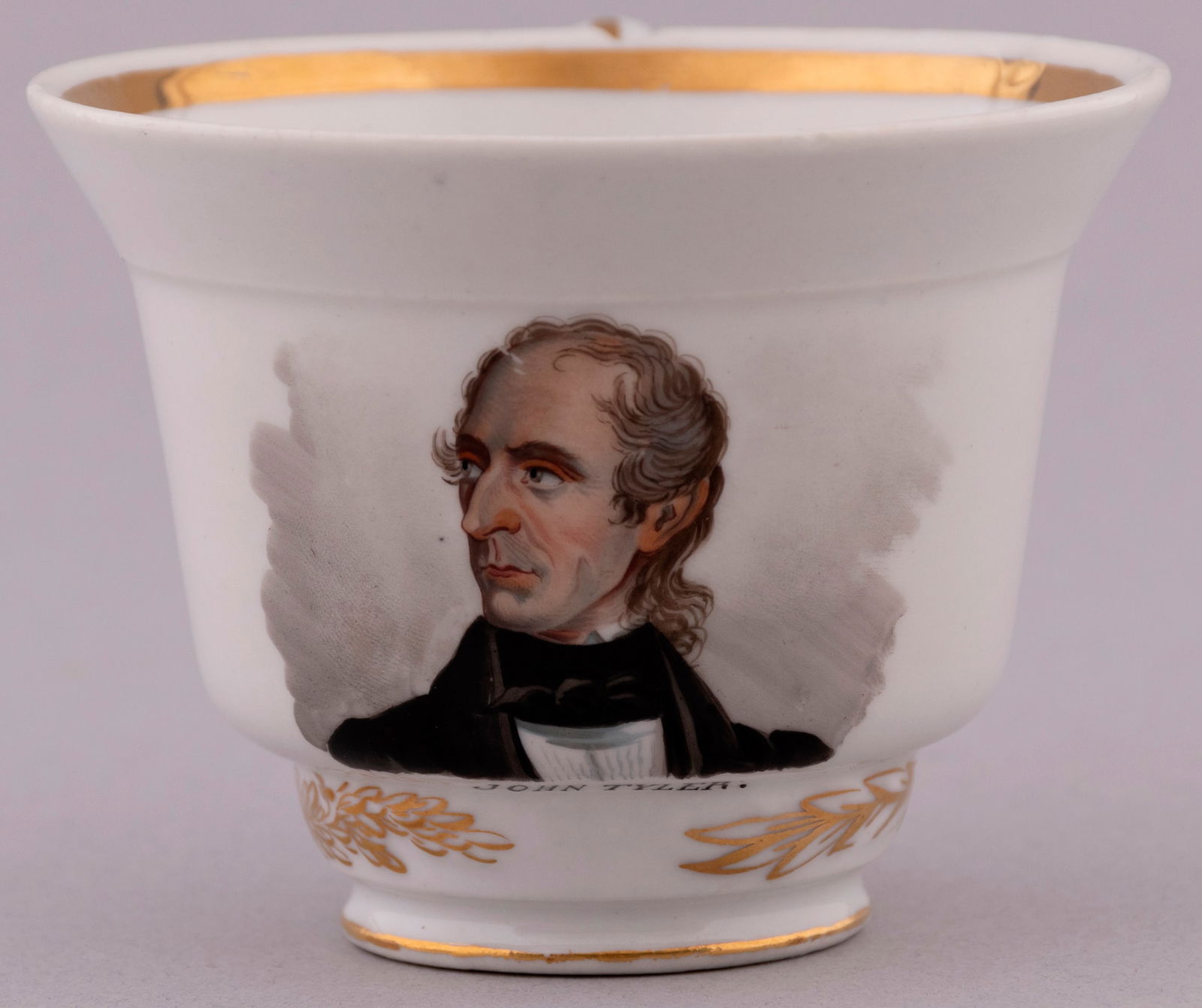 "JOHN TYLER" HAND PAINTED FRENCH PORCELAIN TEA CUP.: 2.75" tall. White porcelain w/gold leaf & strong likeness. .25" chip above handle, wear to polychrome on handle & single scratch at forehead. Hard to find example from a set believed to be produced in