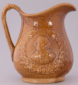 WASHINGTON PORTRAIT BROWN GLAZE STONEWARE PITCHER.