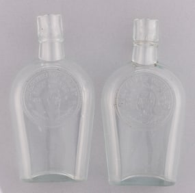 McKINLEY & BRYAN "GOLD STANDARD" & "FREE SILVER" GLASS PORTRAIT FLASK PAIR.