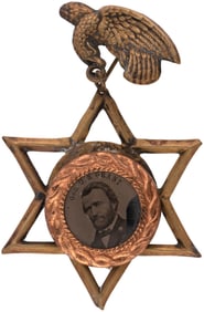 GRANT FERROTYPE IN SIX POINTED STAR BRASS SHELL FRAME WITH EAGLE HANGER.