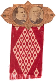 CLEVELAND & THURMAN 1888 BRASS SHELL JUGATE BADGE W/ RED BANDANA RIBBON.