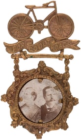 BRYAN & SEWALL "FOR GOOD ROADS" BRASS SHELL JUGATE BADGE.