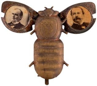 McKINLEY & HOBART MECHANICAL GOLD BUG JUGATE BADGE HAKE #189.