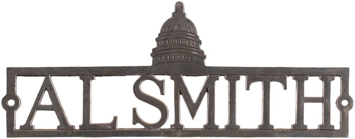 "AL SMITH" RARE DIE CUT US CAPITOL MOTIF 1928 LICENSE PLATE ATTACHMENT.