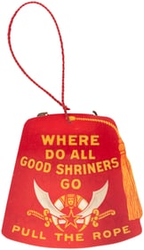 FIGURAL SHRINER'S FEZ CELLO FLIP PIN FOR 1912 LONG BEACH CONVENTION.