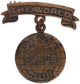 THE WORLD SANTA CLAUS CLUB BRASS BADGE.