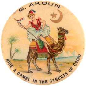 RARE 1898 EXPO BUTTON FOR "G. AKOUN - RIDE A CAMEL IN THE STREETS OF CAIRO."
