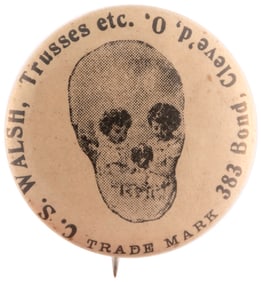 C. 1910 SKULL IMAGE FORMED BY TWO YOUNG CHILDREN & DOG "TRUSSES" DEALER BUTTON.