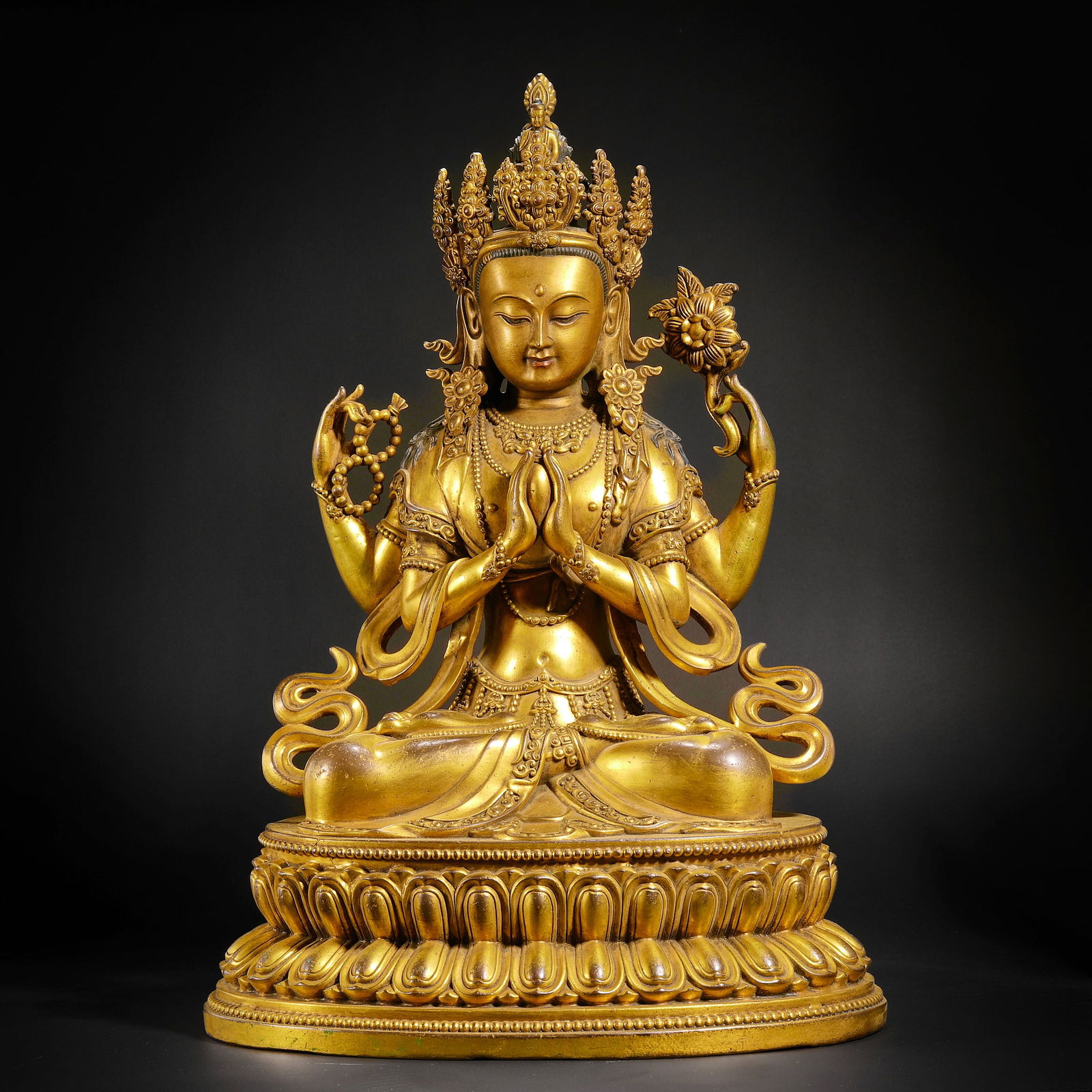 A gilt bronze four-armed Guanyin statue from the Ming Dynasty (1 of 18)