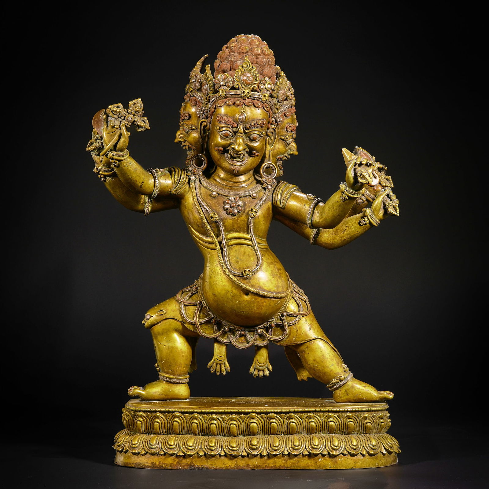 A Ming Dynasty gilt bronze statue of Mahakala with three heads and six arms. (1 of 17)