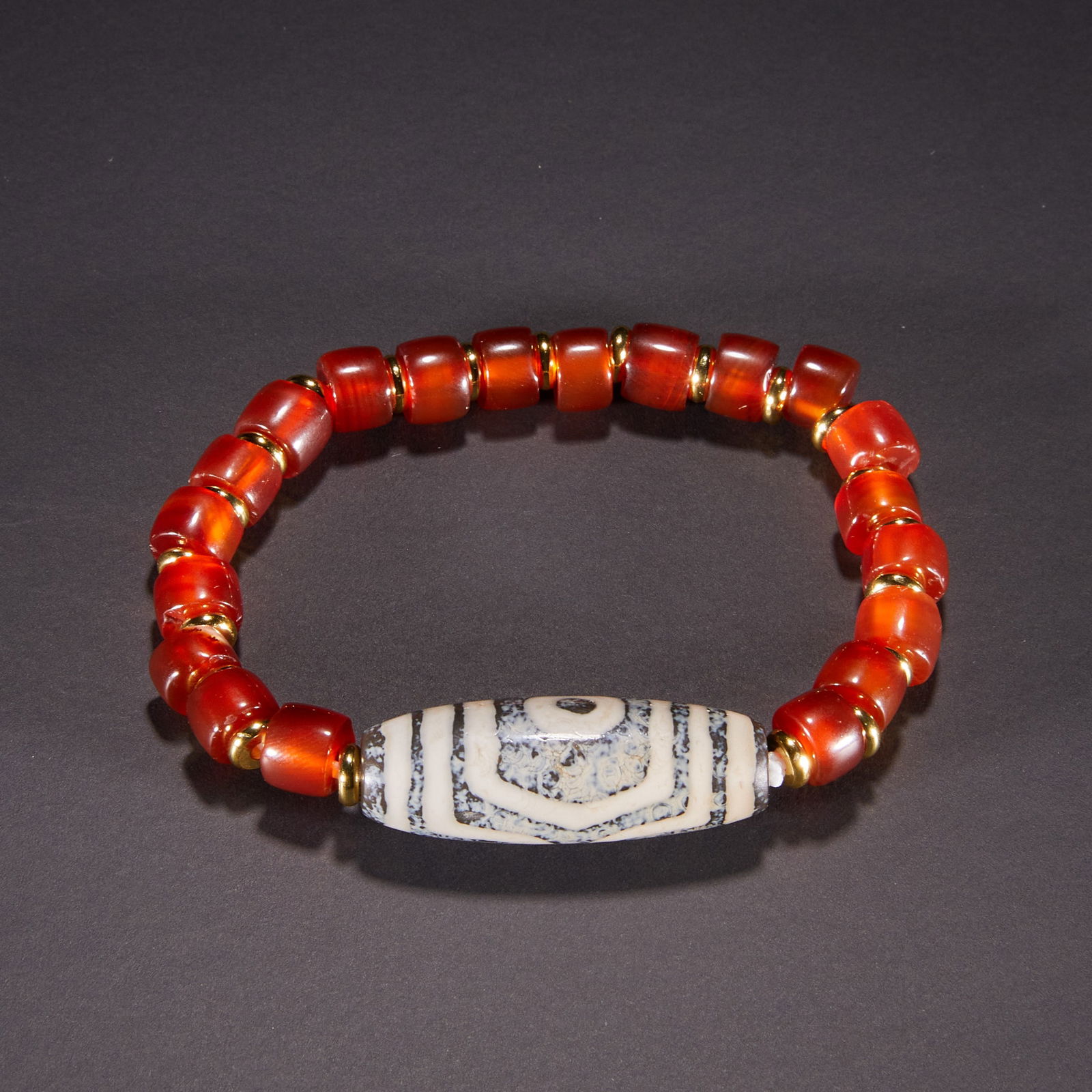 Two-eyed dzi bead bracelet offered as a form of fire offering before the Ming Dynasty (1 of 6)