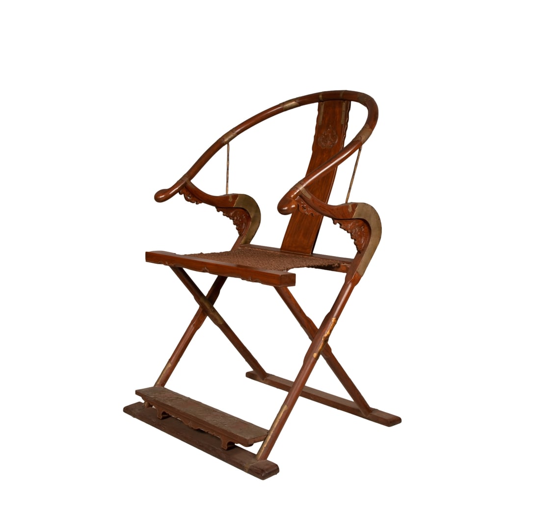 A huanghuali wood armchair with ruyi cloud pattern from the Qing Dynasty. (1 of 7)