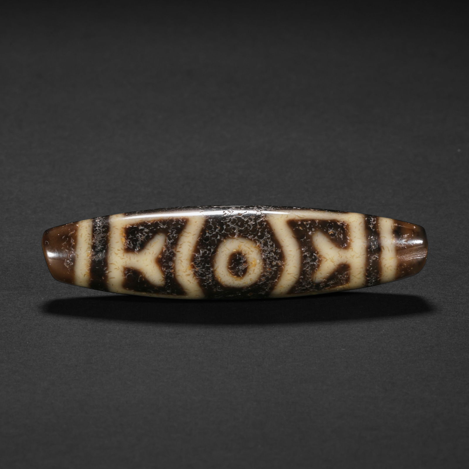 17th-century two-eyed dzi bead: 45417th-century two-eyed dzi bead