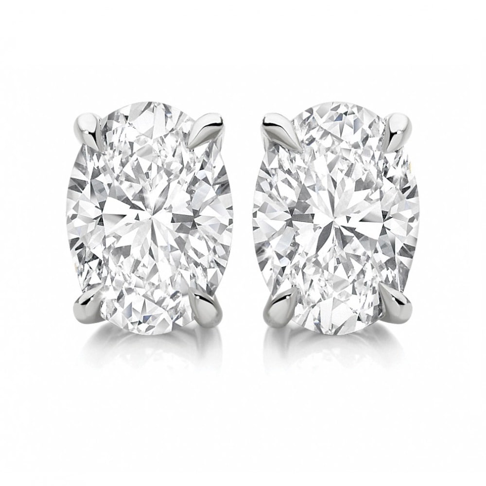 12.31 carat diamond pair, Oval cut Diamonds IGI Graded: This lot comes loose and unmounted 1) Click here to view HD 360 Spinning Image