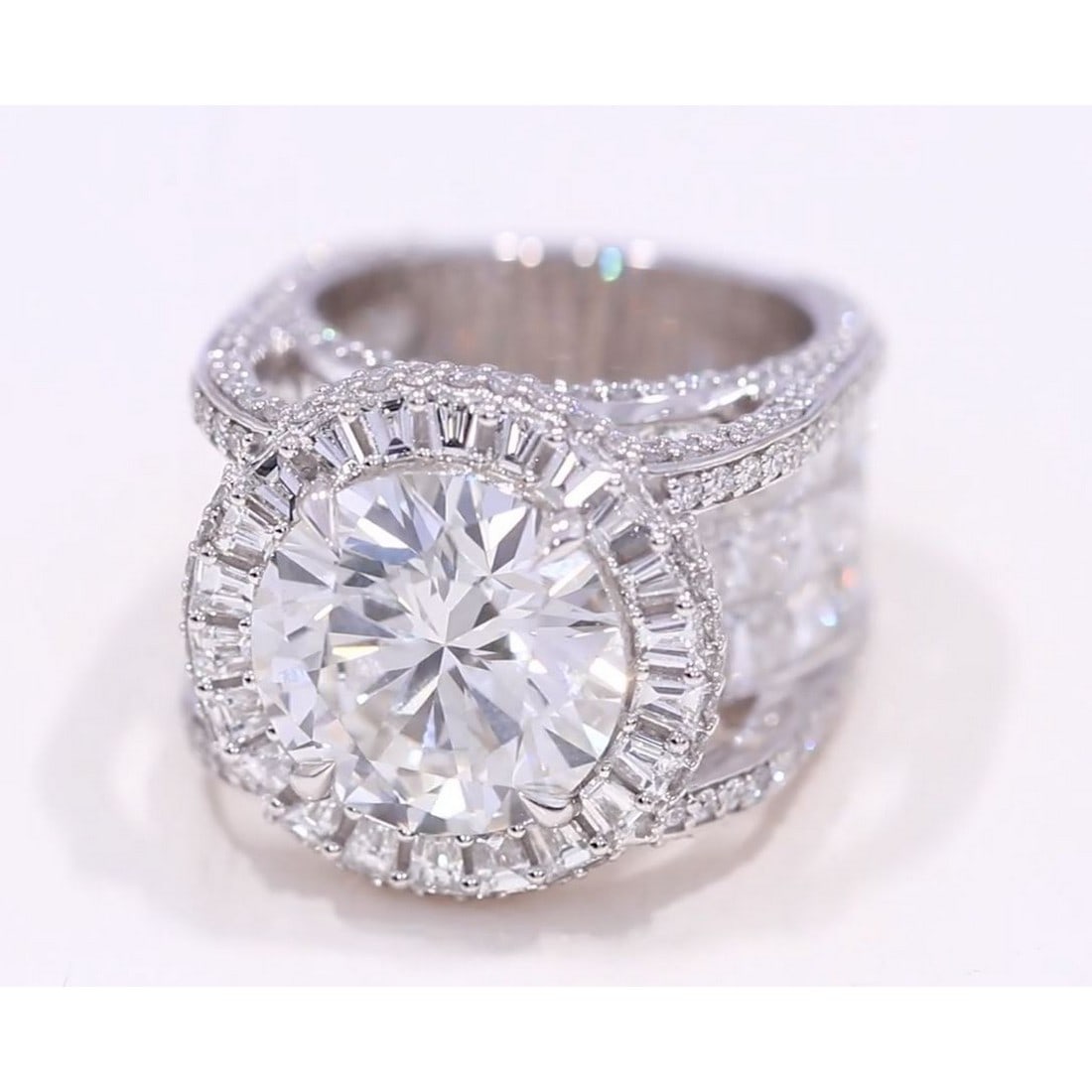 14Kt White Gold 21 ct. Diamond Ring: Gold Content: 14Kt White Gold Size (US): 6-10 Main Gemstone: Lab Grown Diamond Total number of gemstones: 115 Shape(s): Round, Princess & Baguette Total Carat Weight (Appro.): 21Center Gemstone C