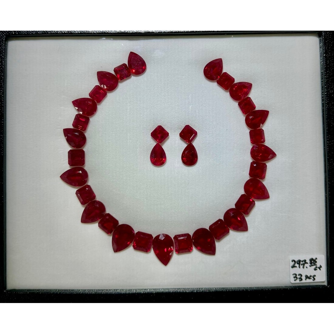 Set of 33 Lab Grown Red Ruby Layout: Gemstone Type: Red Ruby (Lab Grown) Cut Shape: Octagon & Pear Measurement (Appro.): Octagon 9x9 ~ 11x11, Pear 10x13 ~ 13x19 (in mm) Total no. of Lab Gemstones: 33 Total Carat Weight (Appro): 2
